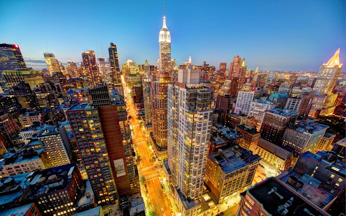 The Empire State Building bathed in the glow of New York City's morning lights