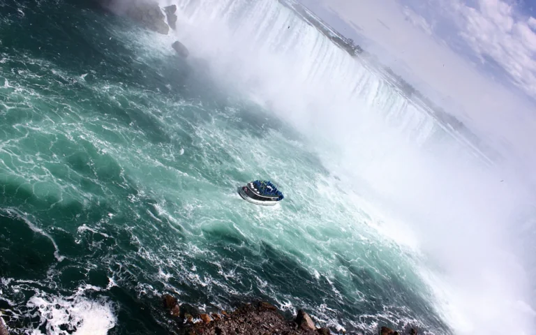 A tour boat in the turbulent waters of Niagara Falls