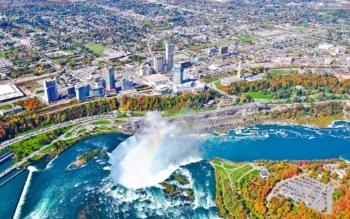 An aerial view of Niagara Falls and the skyscrapers of Canada