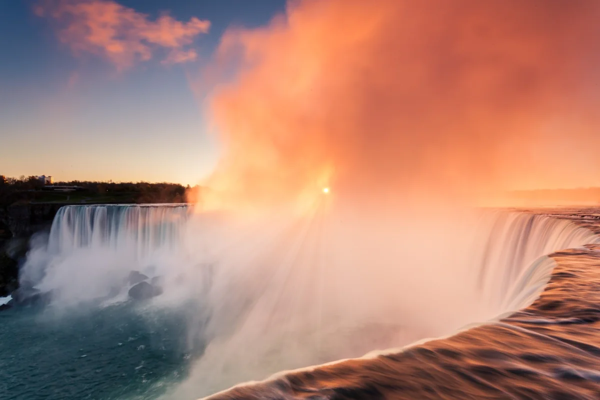 The golden glow of sunset over Niagara Falls