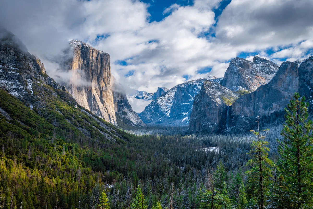 The rocky peaks of El Capitan, enveloped in clouds