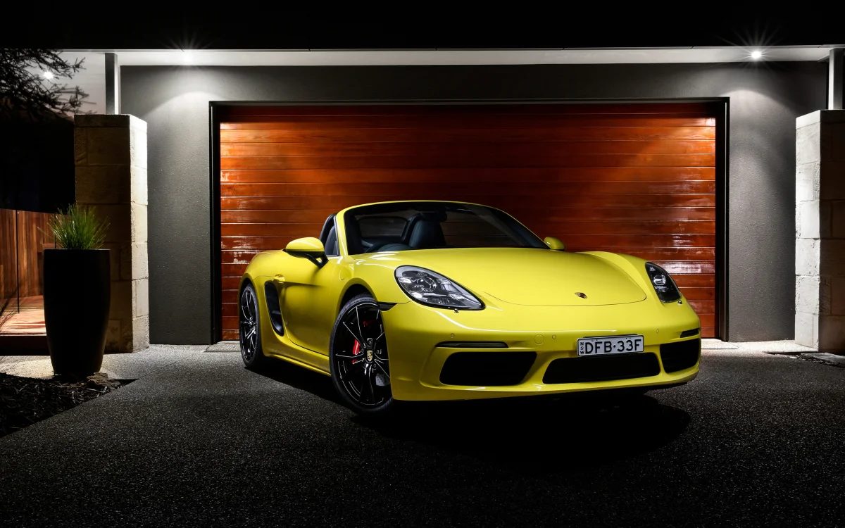 a yellow porsche 718 boxster in the garage, porsche 718 boxster, electric cars, electric vehicles, porsche, auto, cars, vehicles