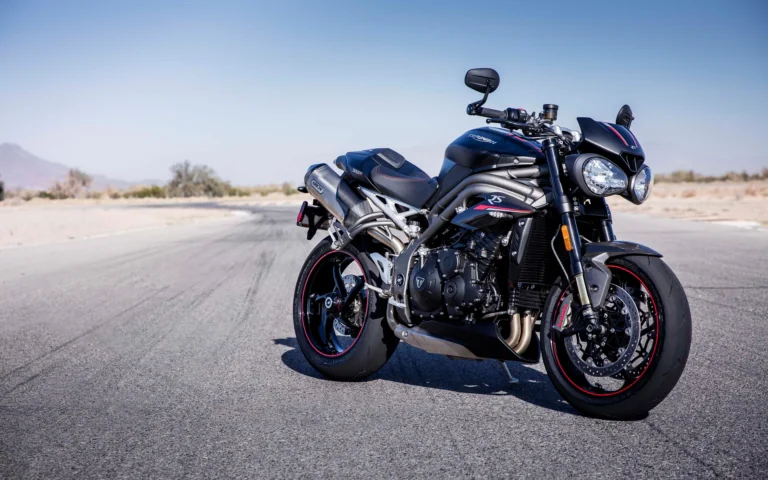 A black Triumph Speed Triple RS on an empty race track